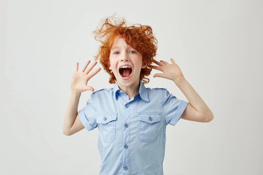 close-up-joyful-little-ginger-boy-with-freckles-jumping-having-fun_Easy-Resize.com